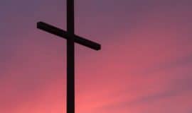 christian cross with sunset background