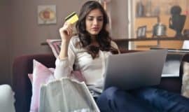 young lady with laptop and credit card