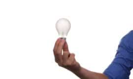 hand holding a lightbulb