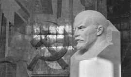 A bust of Lenin and a mosaic of the hammer and sickle